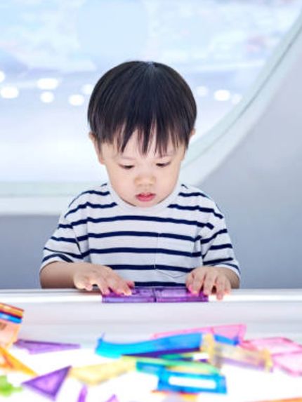 Child Working on a Puzzle