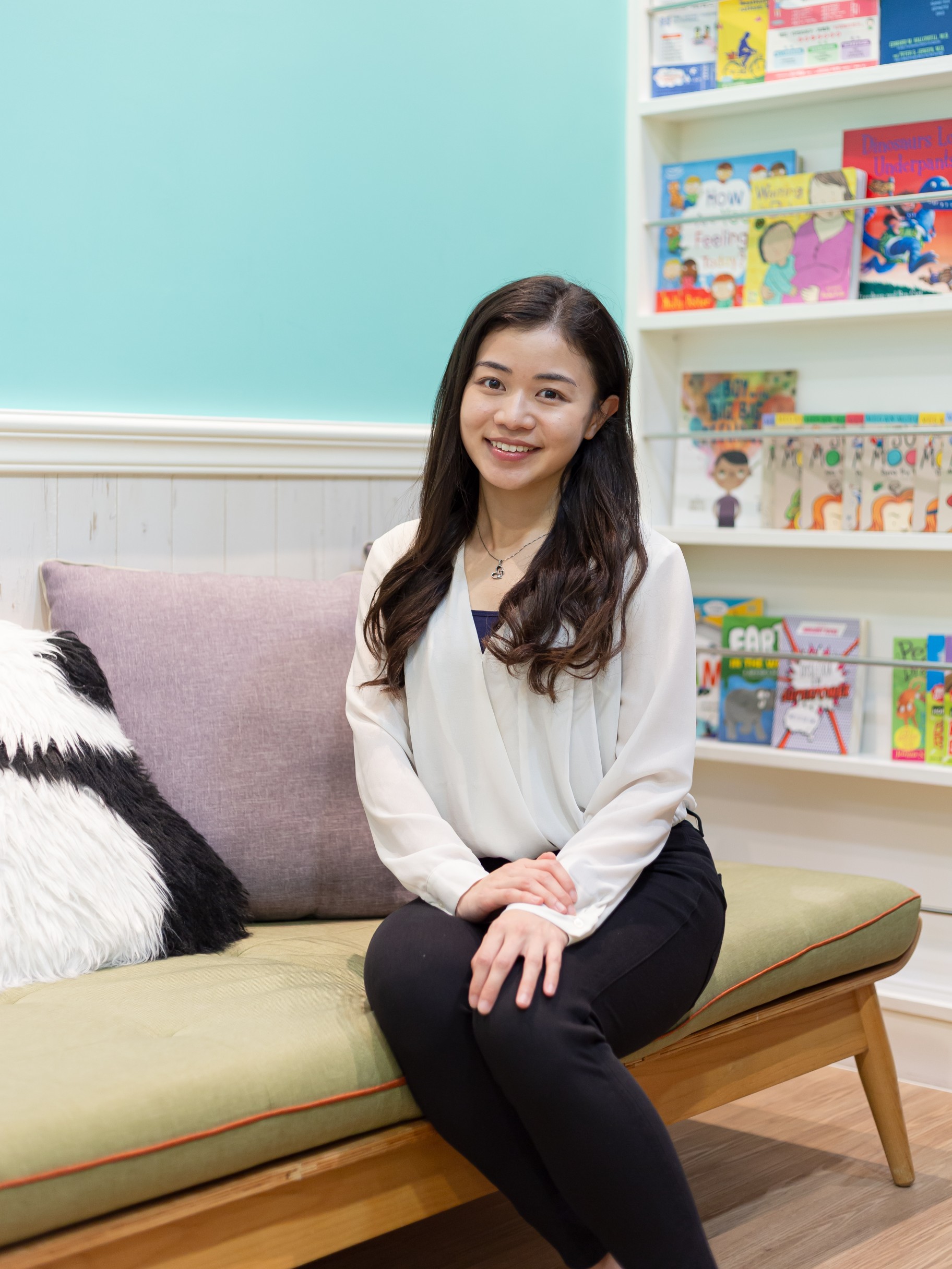 Yukie Kwok sitting in the middle of the room smiling