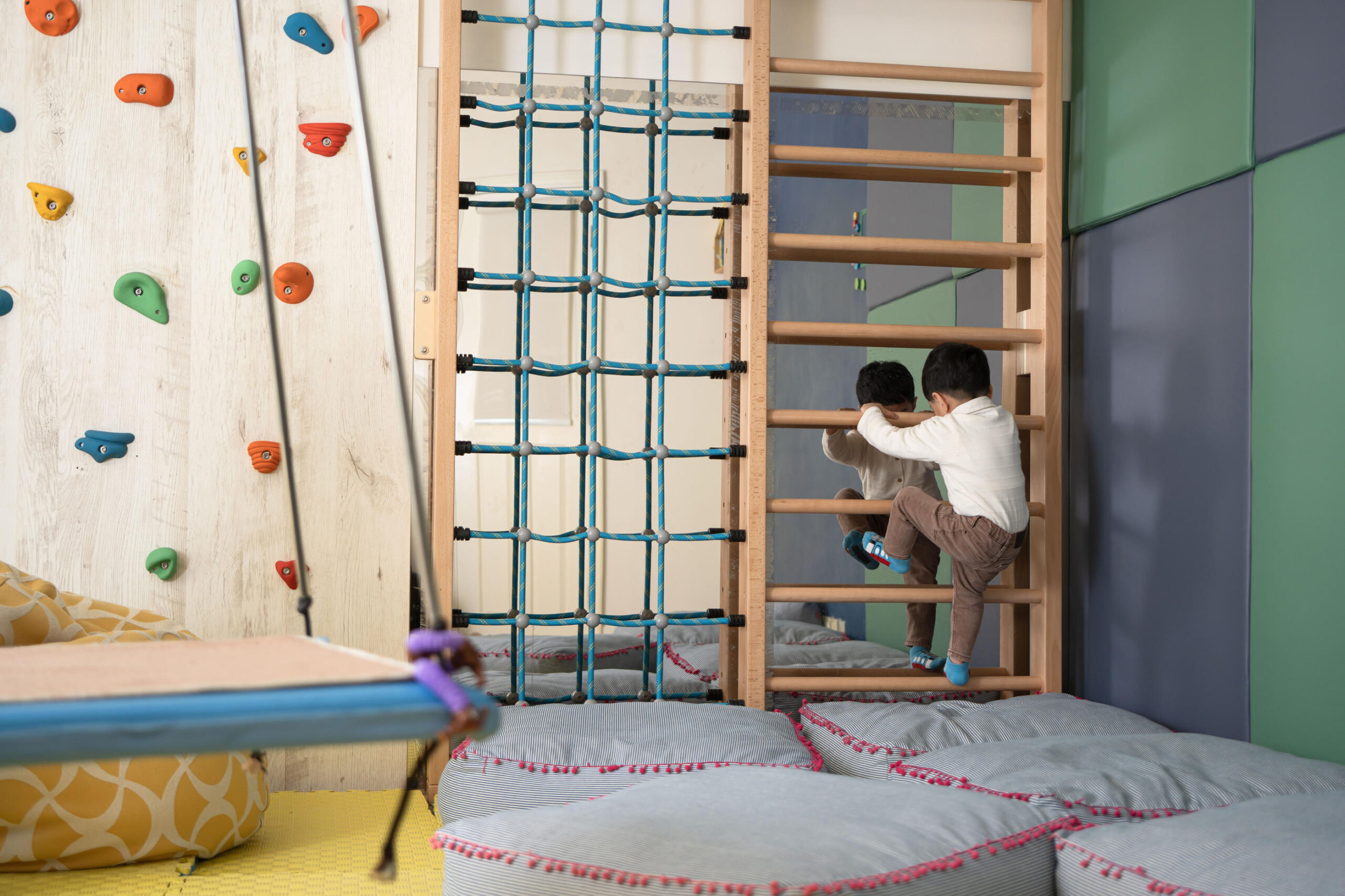 Fully equipped OT room with monkey bars, rock climbing, swing and padded walls and floor to ensure a safe and fun-tastic enviornment!