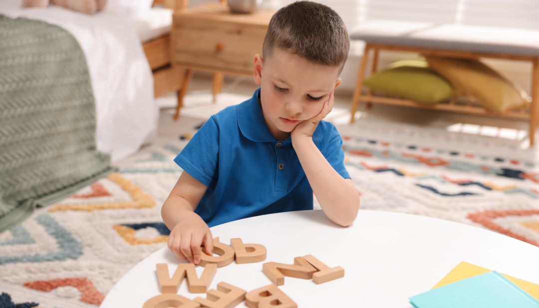 a boy difficulty in naming letters