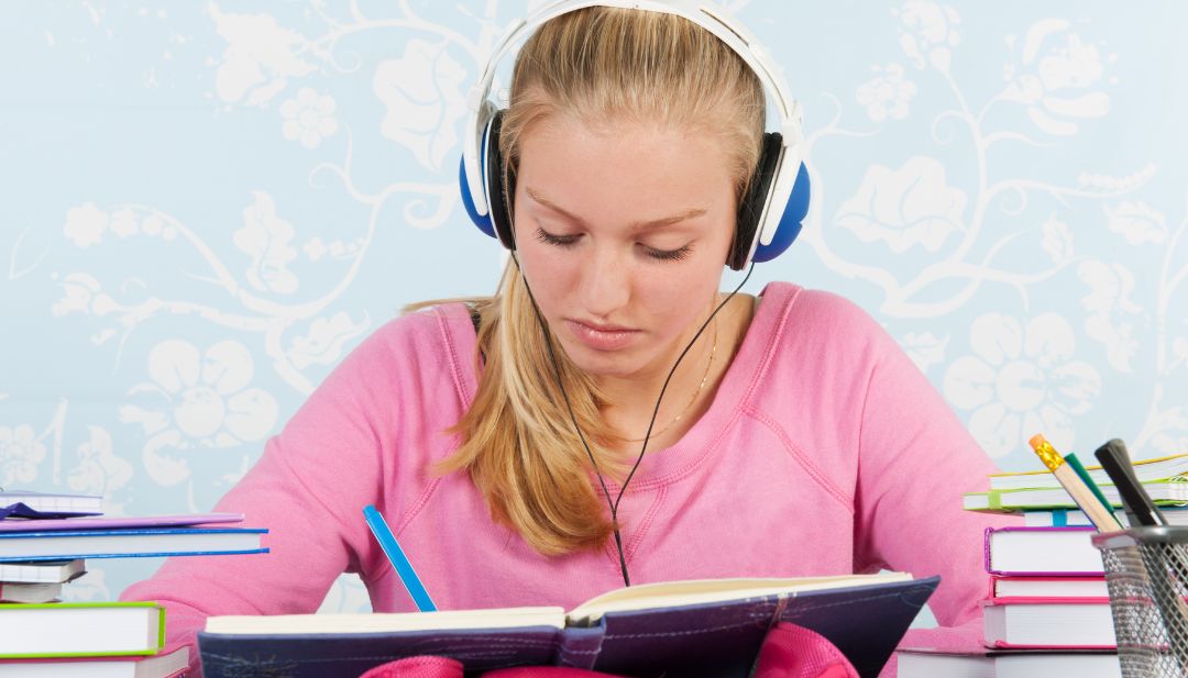 teen girl taking exam, headphones